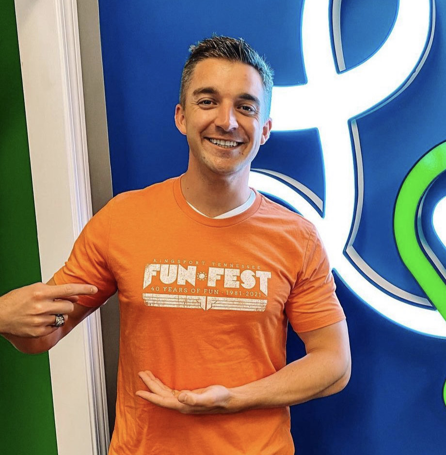 Dr. Jewett showing his "fun fest" t shirt