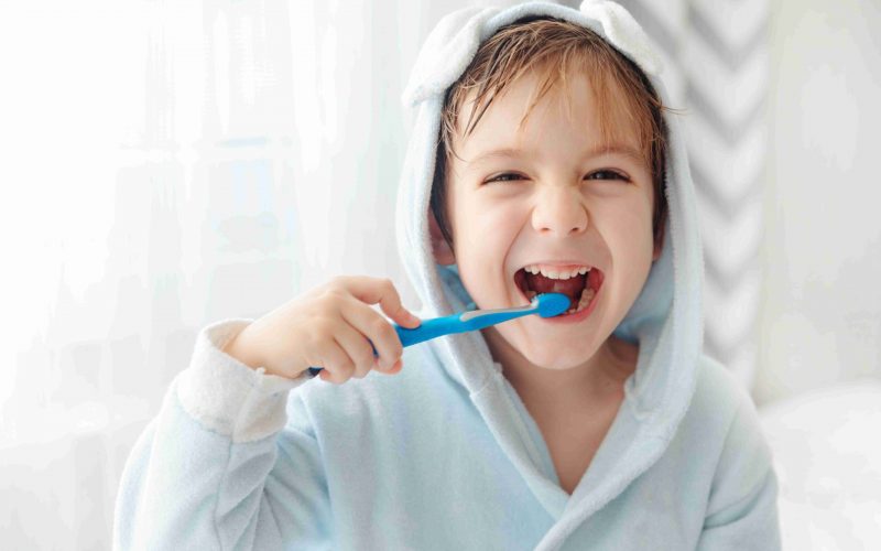 smiling-happy-child-brushing-teeth-with-toothbrush-2022-09-19-21-54-15-utc (1)